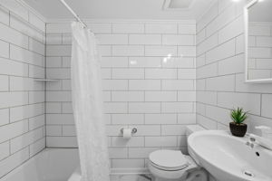 Full bath in basement level, with tub