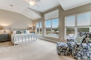 The amazing master suite with king bed, dressers ......