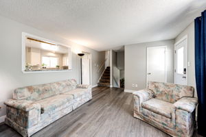 Living Room w Peak-a-boo Window to Kitchen