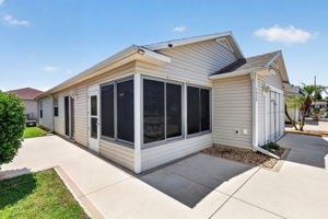 Front Elevation with Spacious Front and Side Patiops