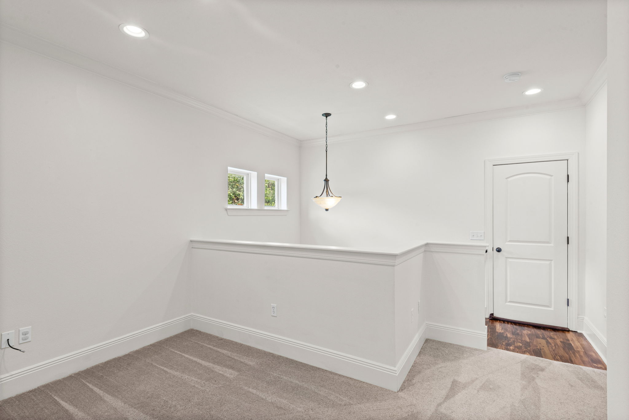 Landing with plenty of room for desk, chairs, play area, reading nook.