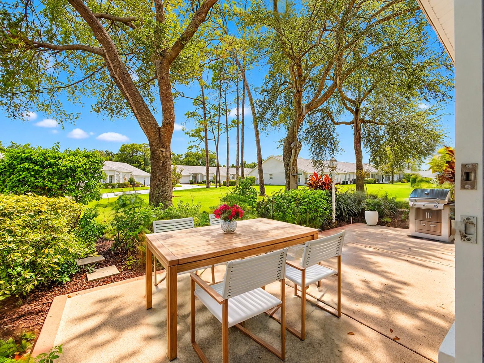 Sunlit Suburban Patio Garden View virtually staged.jpeg