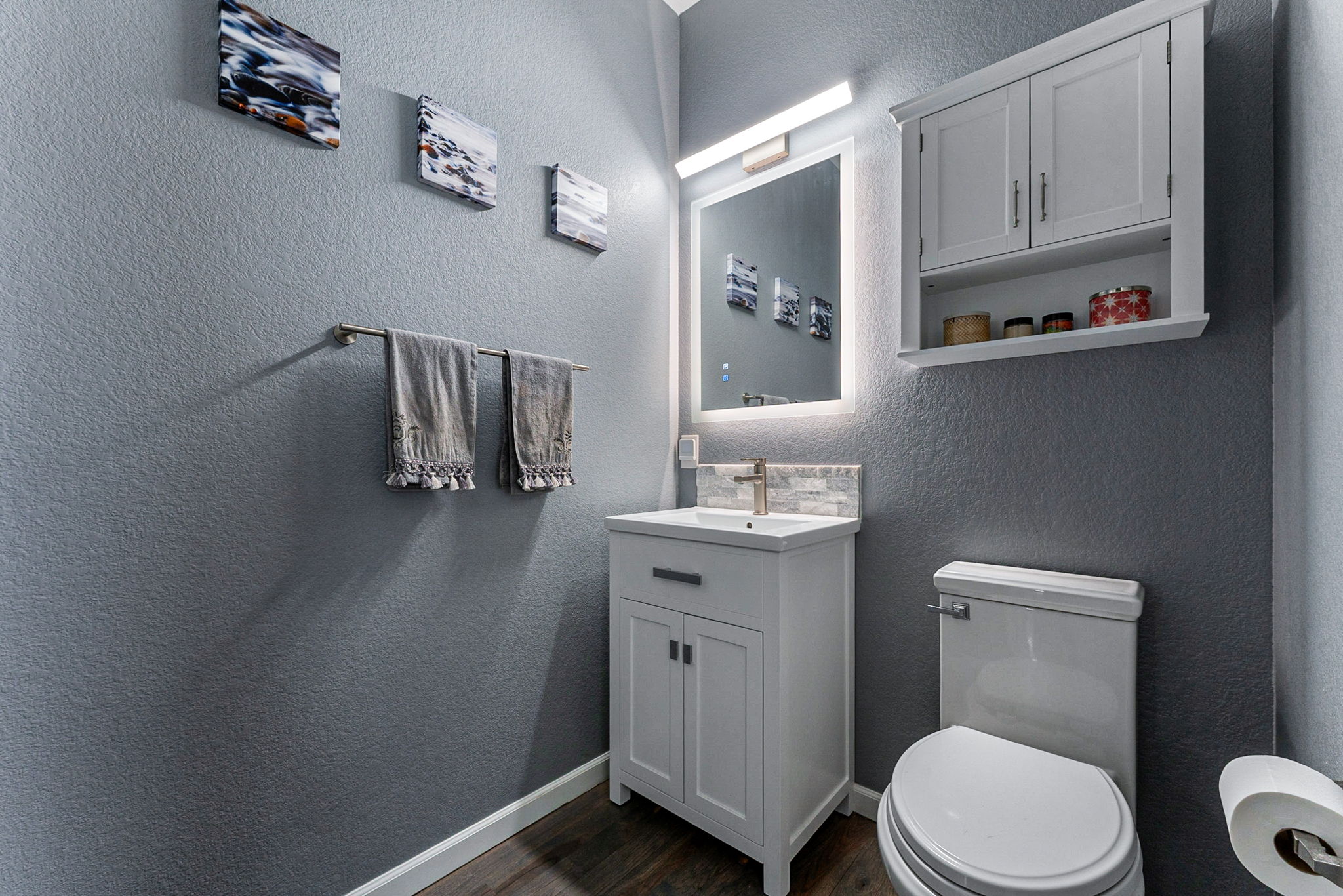 Half bathroom is tastefully updated