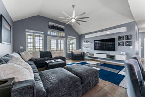 Large open living room leading to the sunroom
