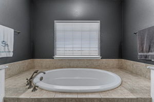 Large soaking tub with western facing views