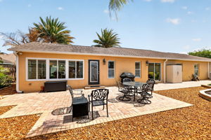 Spacious Side Paver Patio with Enhanced Stoned Hardscaping