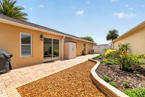 Spacious Side Paver Patio with Enhanced Stoned Hardscaping