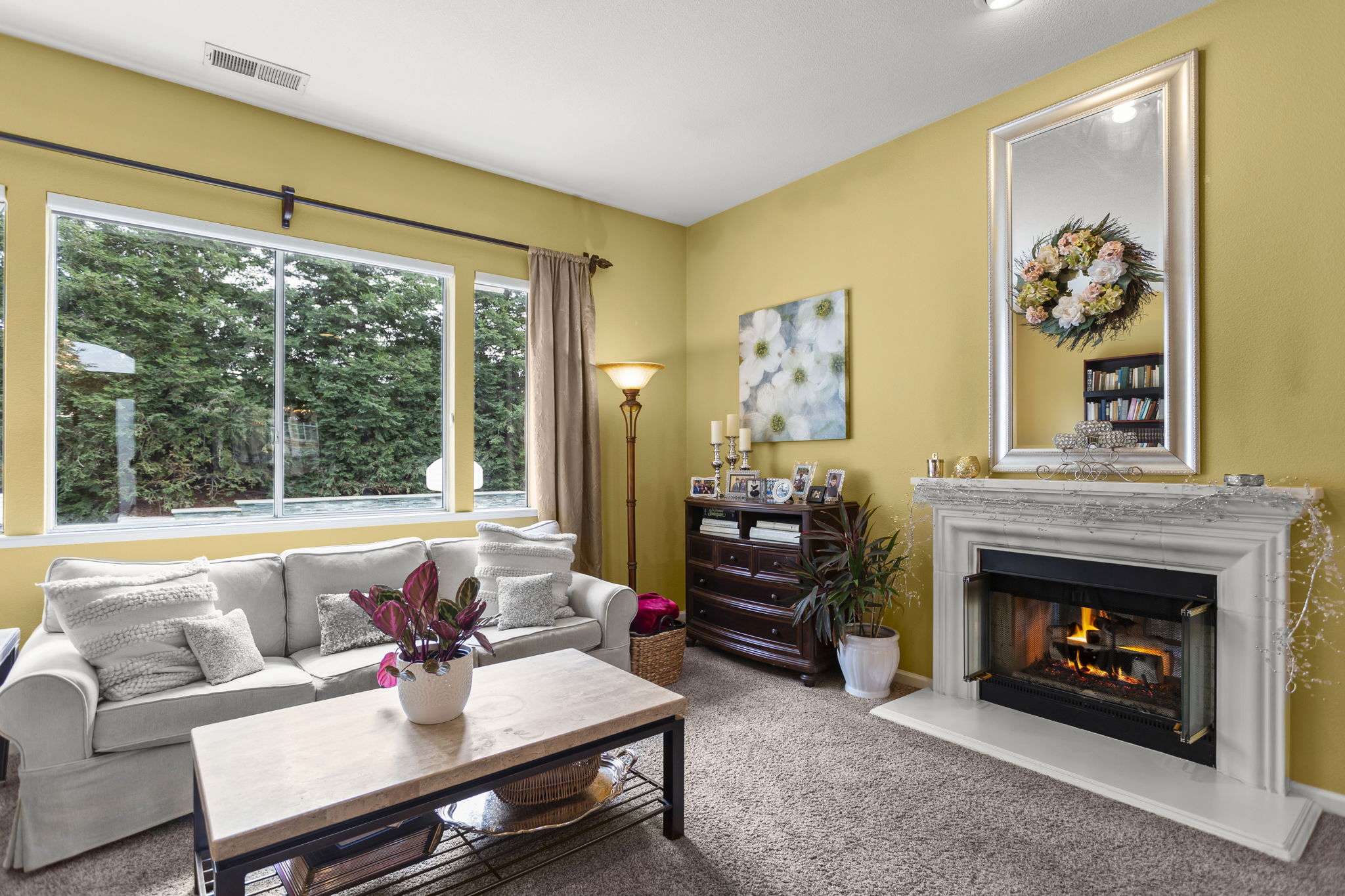 Living room with fireplace that also passes through to family room