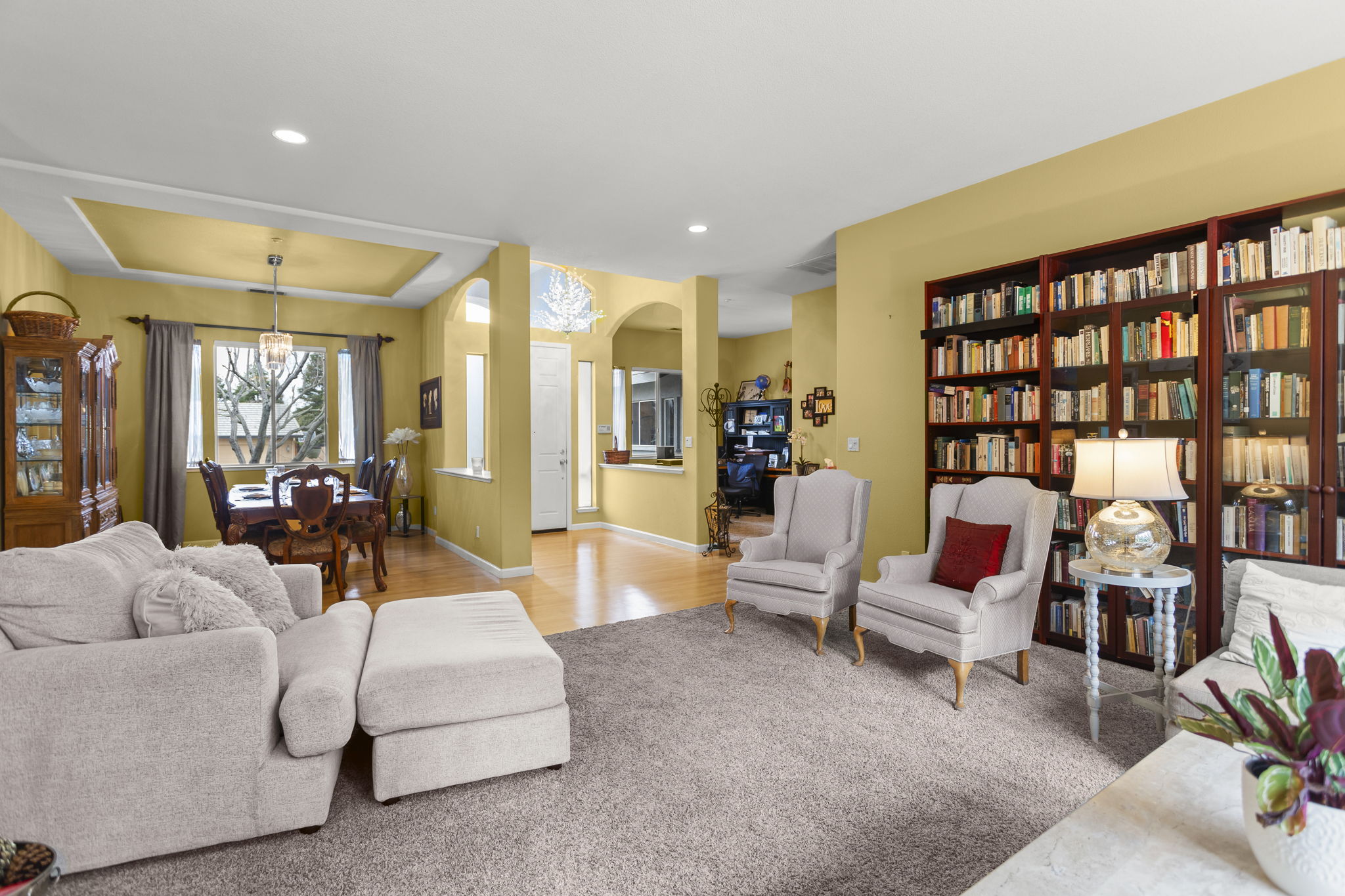 View from living room toward (left to right) dining room, entry, den/office