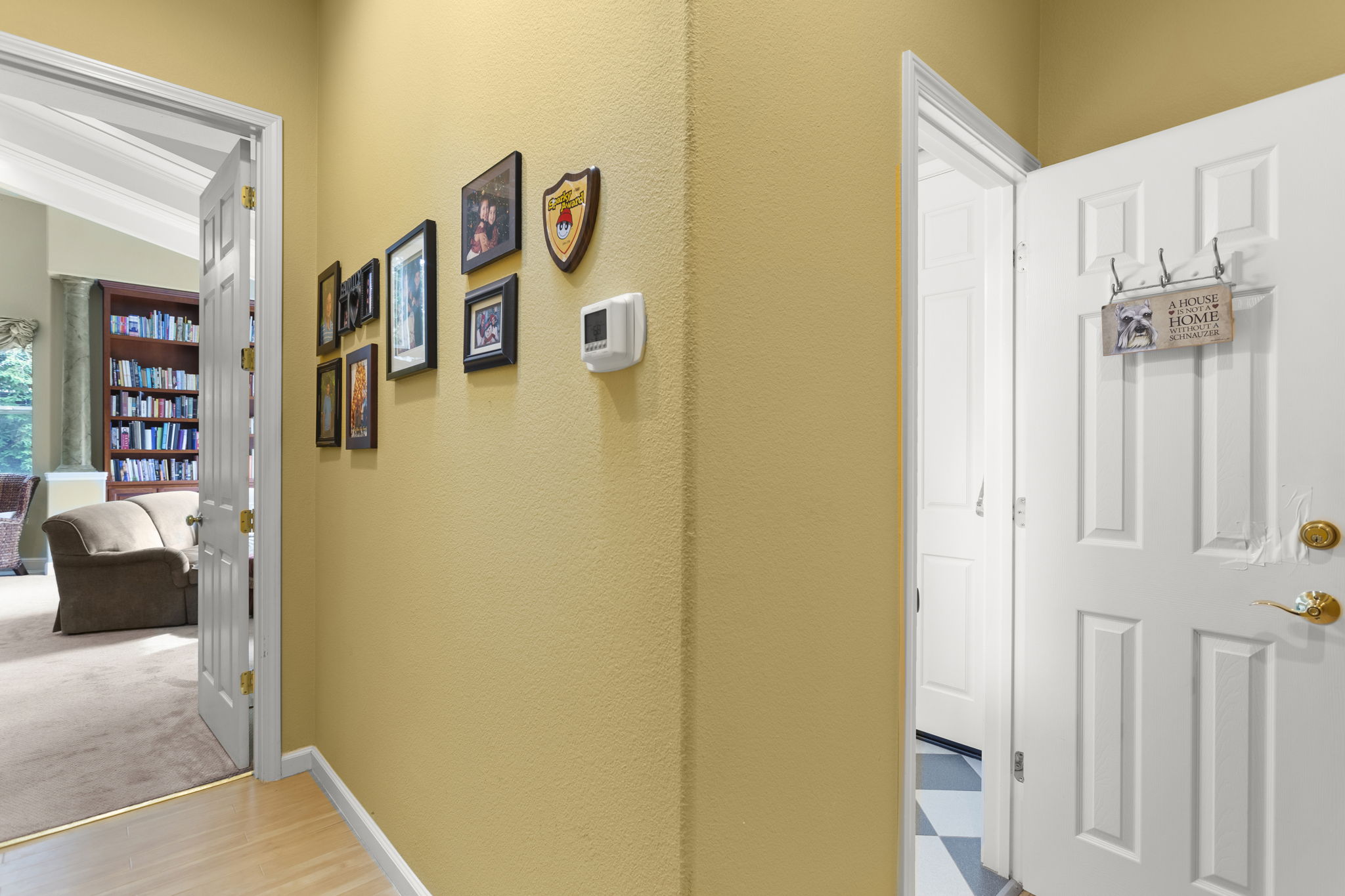 Hallway to primary master suite. Bath #5 on right, with shower & door to outside and pool/spa area