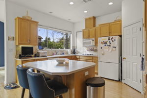 Island kitchen with walk-in pantry on right