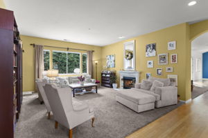 Living room with fireplace that also passes through to family room