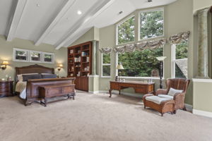 Huge primary/master bedroom suite with view to backyard