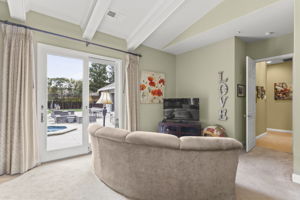 Master BR sitting area with view to exterior hallway on right, French doors to pool/spa area on left