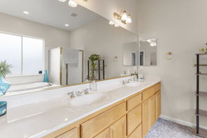 Secondary master bedroom's bath suite with double sink vanity and separate shower & tub