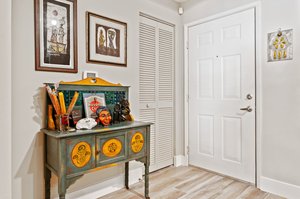 Inside your condo foyer entry....A/C-Water Heater closet by front door