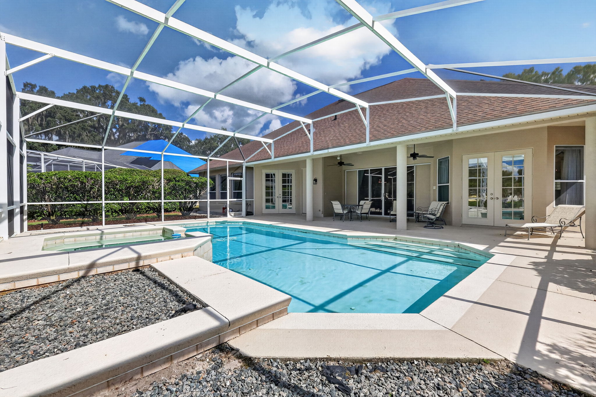 FRENCH DOORS FROM PRIMARY SUITE OUT TO POOL