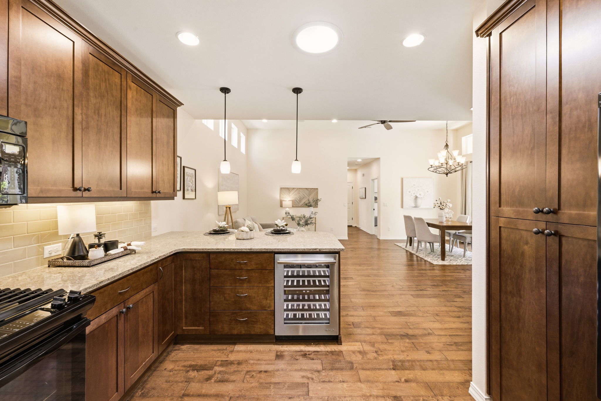 Kitchen. A built-in beverage cooler and open flow to the dining area add convenience for hosting.