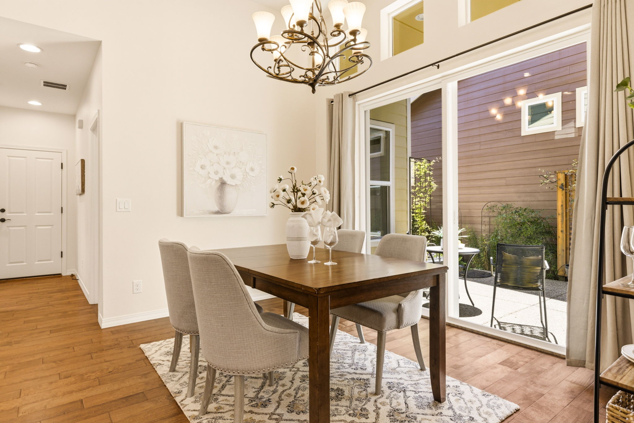 Dining Room. A sliding glass door brings in natural light and opens directly to the outdoor patio.