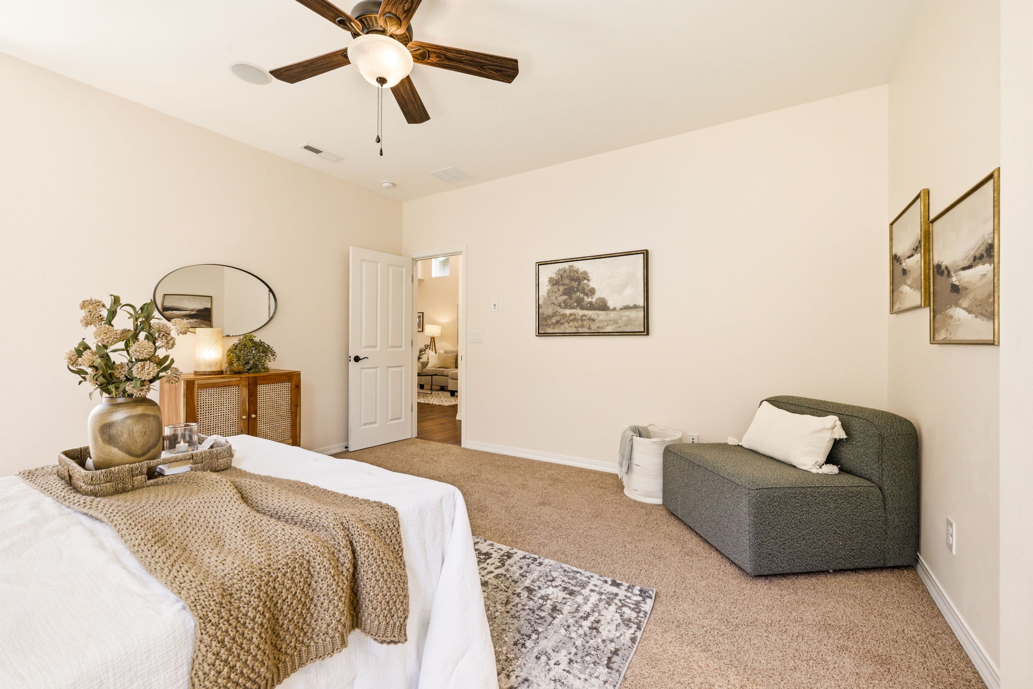 Primary Bedroom. A designated sitting nook adds extra comfort and flexible living space.