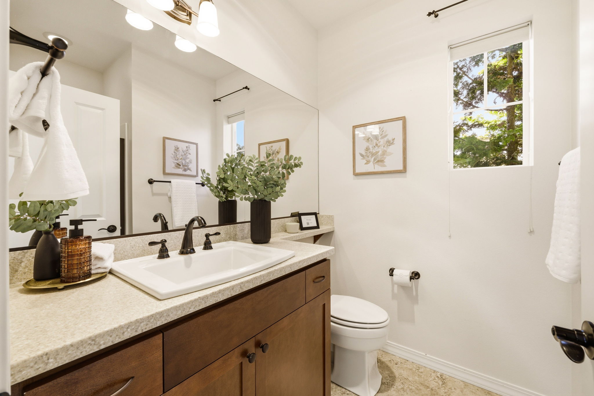 Bathroom. A granite-topped vanity and natural light create a fresh, welcoming feel.