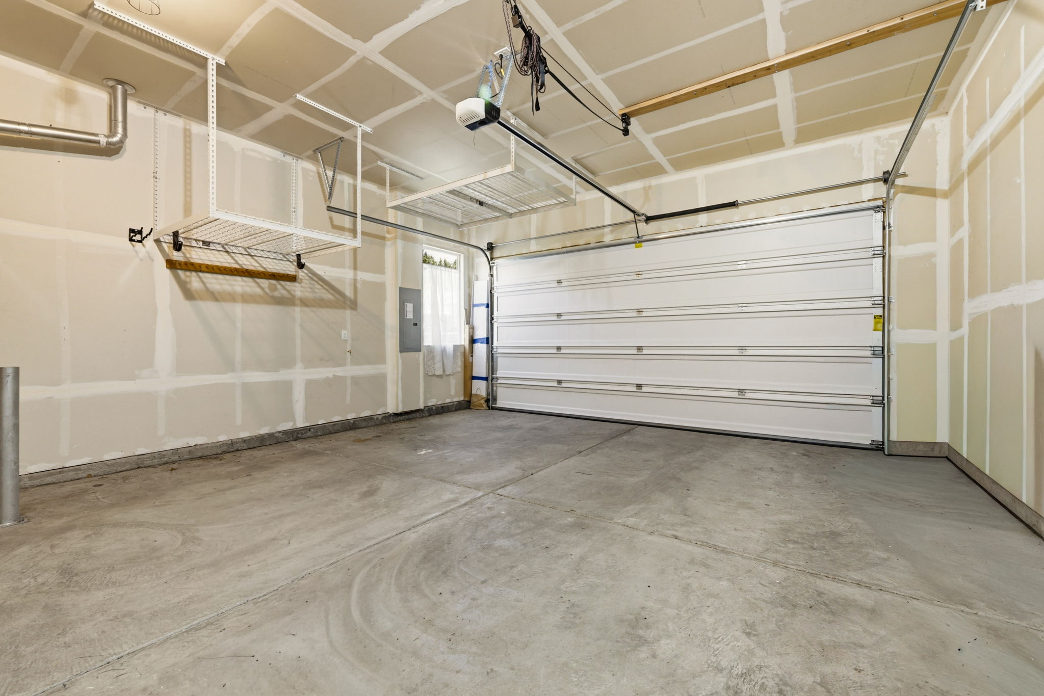Garage. Overhead storage racks maximize space while leaving room for parking and everyday gear.