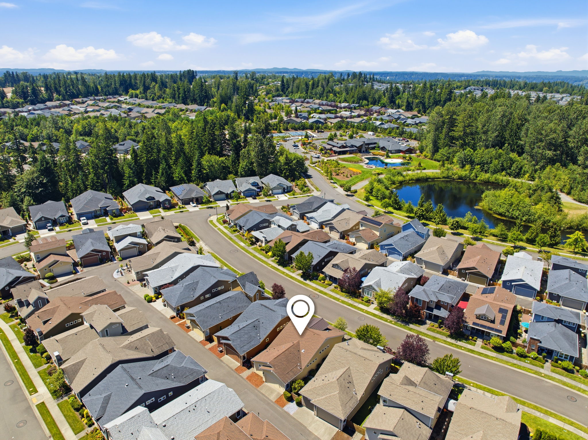 Aerial View. A nearby community pond and green space add to the neighborhood's appeal.