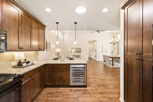 Kitchen. A built-in beverage cooler and open flow to the dining area add convenience for hosting.