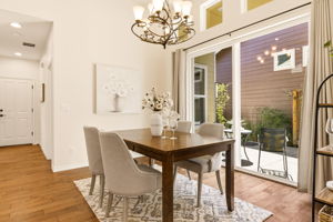 Dining Room. A sliding glass door brings in natural light and opens directly to the outdoor patio.