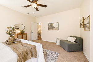 Primary Bedroom. A designated sitting nook adds extra comfort and flexible living space.