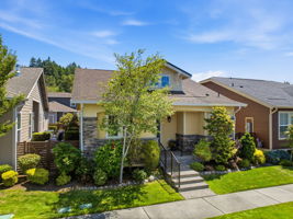 Front Exterior. A tree-lined setting complements the home's classic architectural charm.