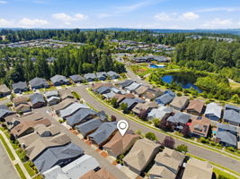 Aerial View. A nearby community pond and green space add to the neighborhood's appeal.