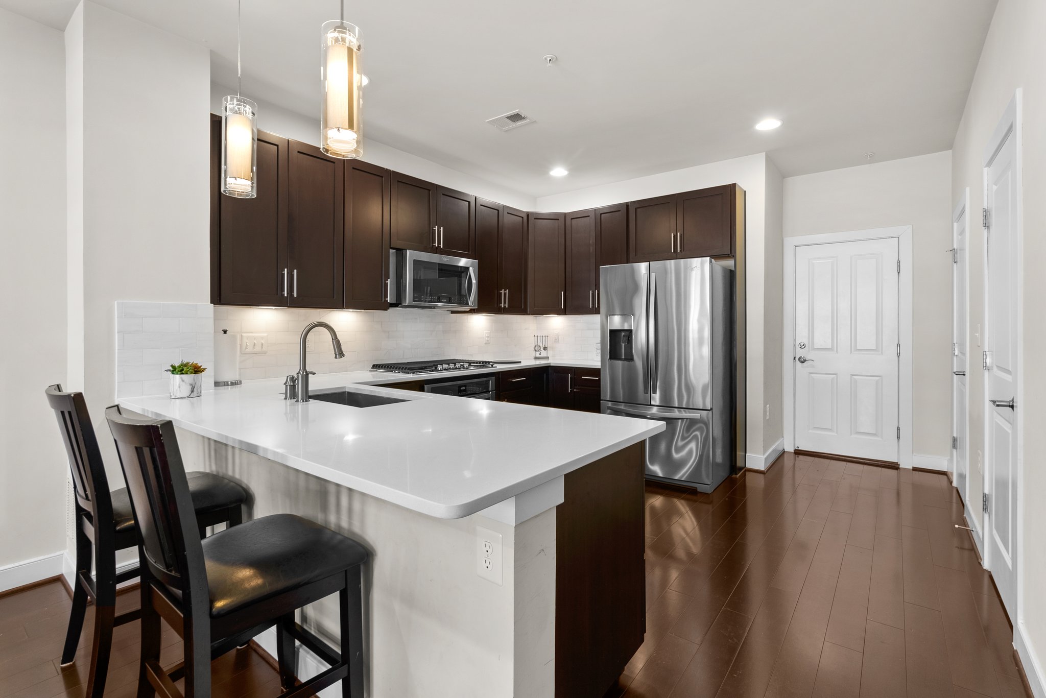 Gorgeous QUARTZ counters & pendant lighting