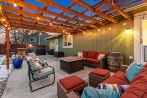 Large pergola-covered patio with removable canvas cover