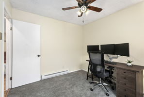 Office/bedroom w/ ceiling fan and new carpet