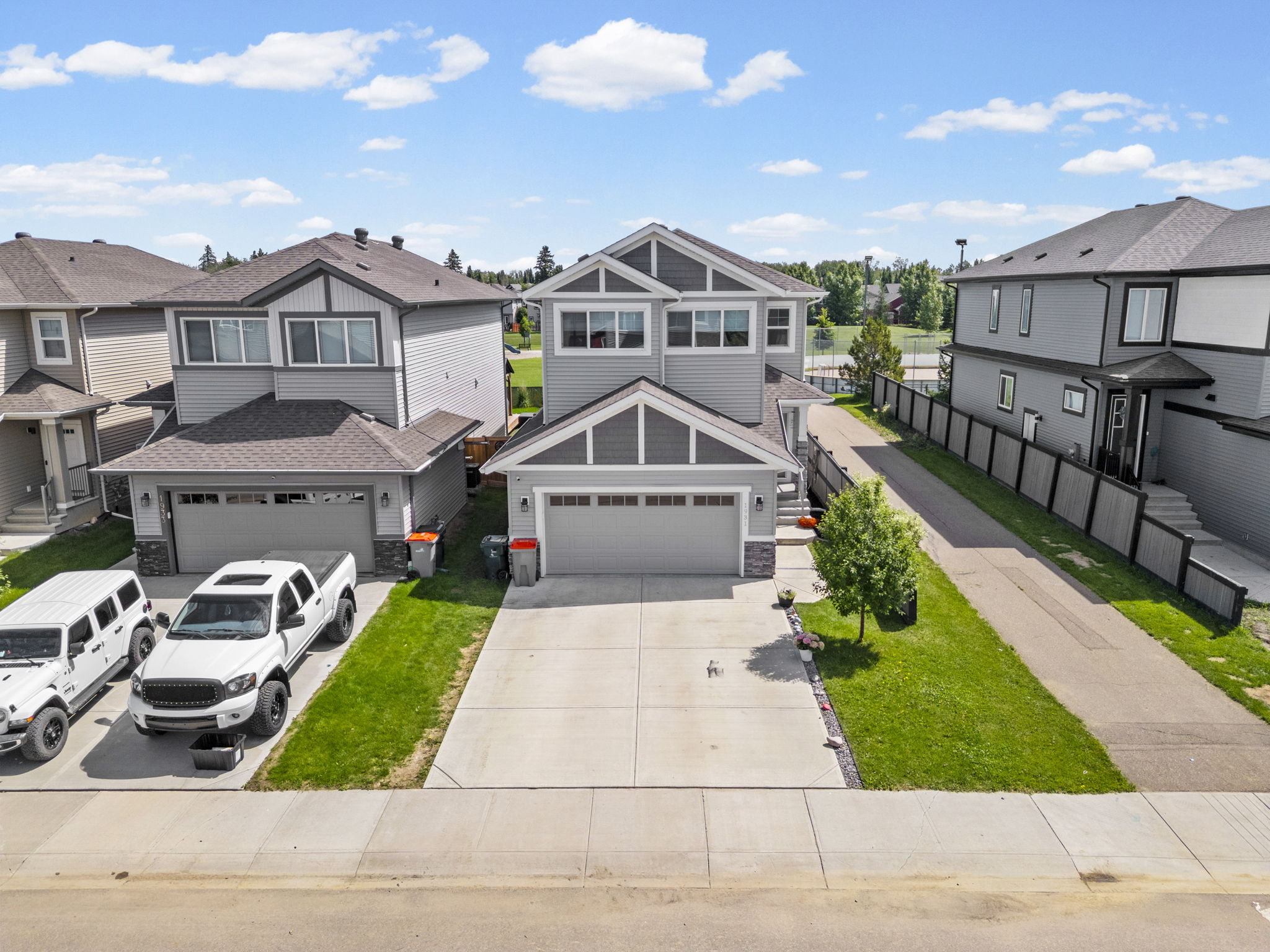 Elevated front view of a two-storey Westerra Lane home and driveway.