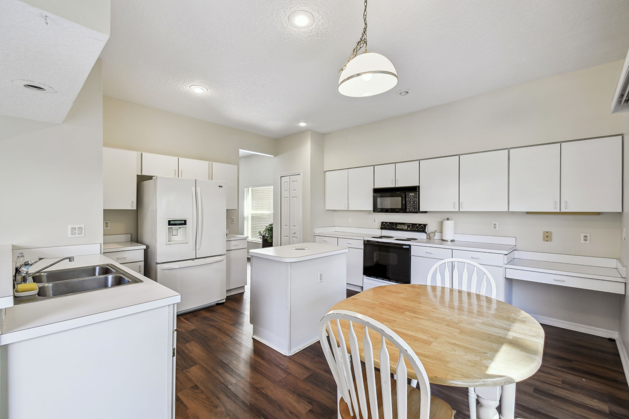 Eat-in kitchen has tons of cabinets