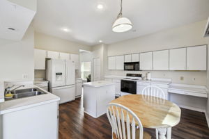 Eat-in kitchen has tons of cabinets