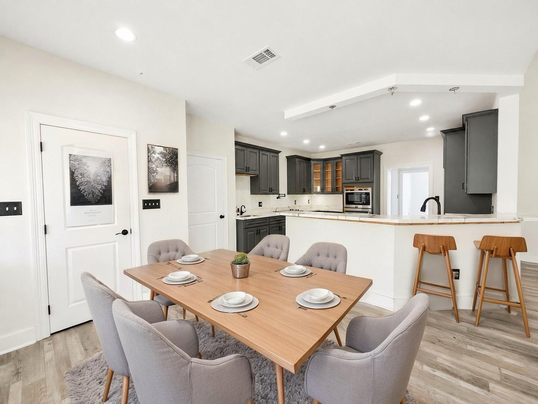 25-kitchen-and-dining-open virtually staged.jpeg