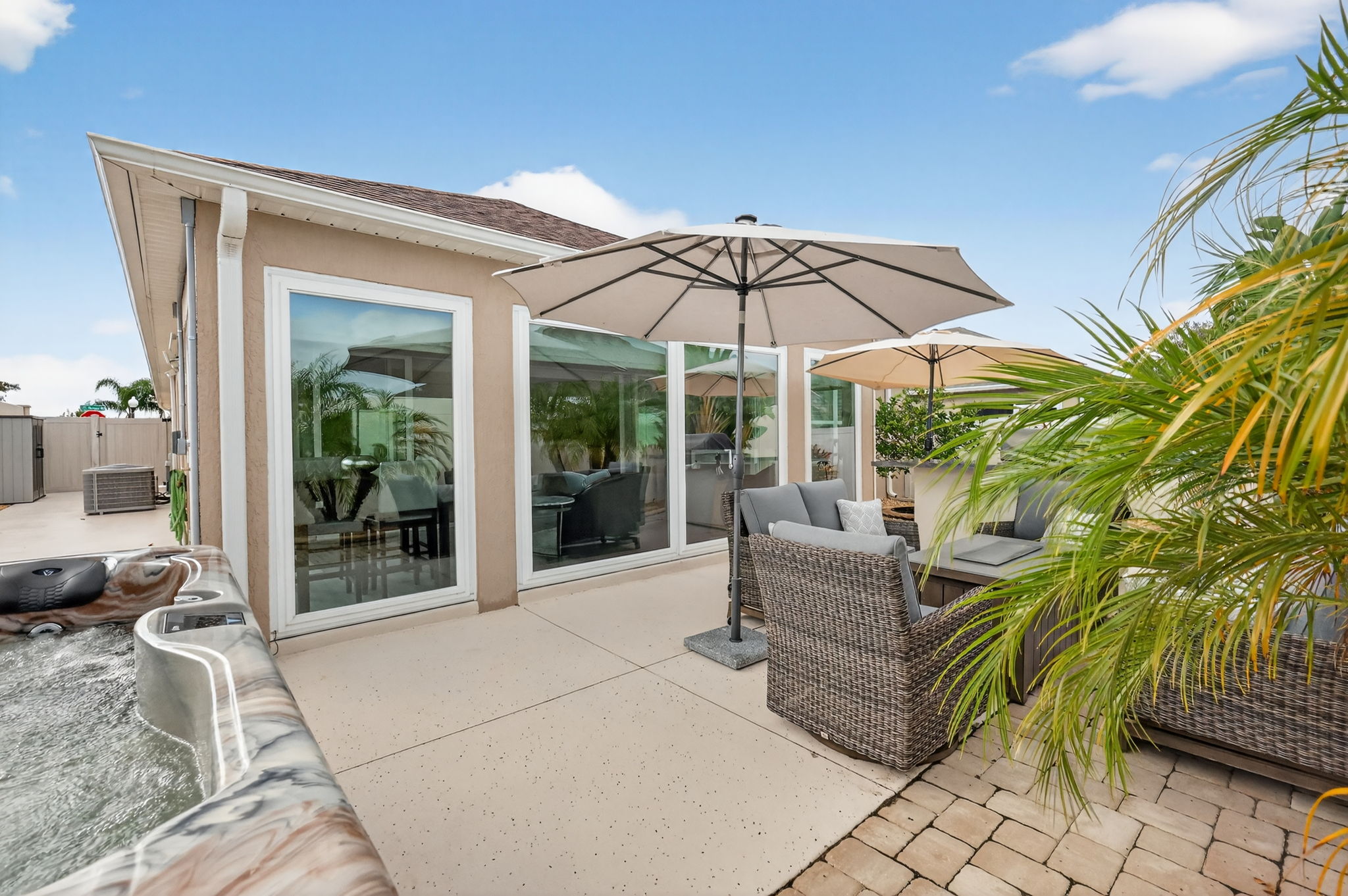 Rear Courtyard with Sitting Area, Hot Tub, and Grilling Kitchen