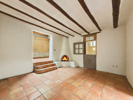 Spacious Primary suite with a kiva wood-burning fireplace and generous wardrobe space.