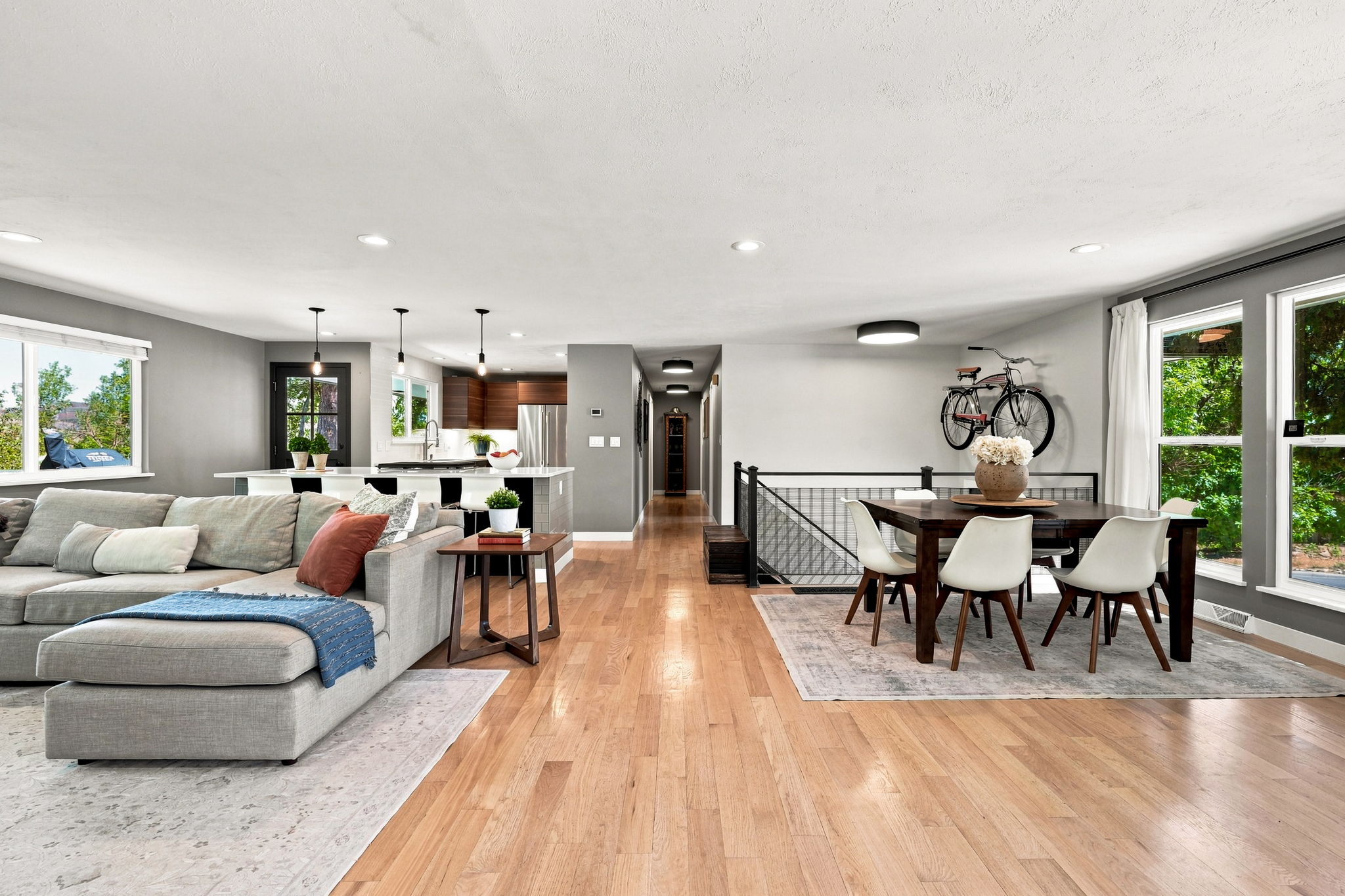 Light-filled open plan with kitchen, living and dining reading as one room.