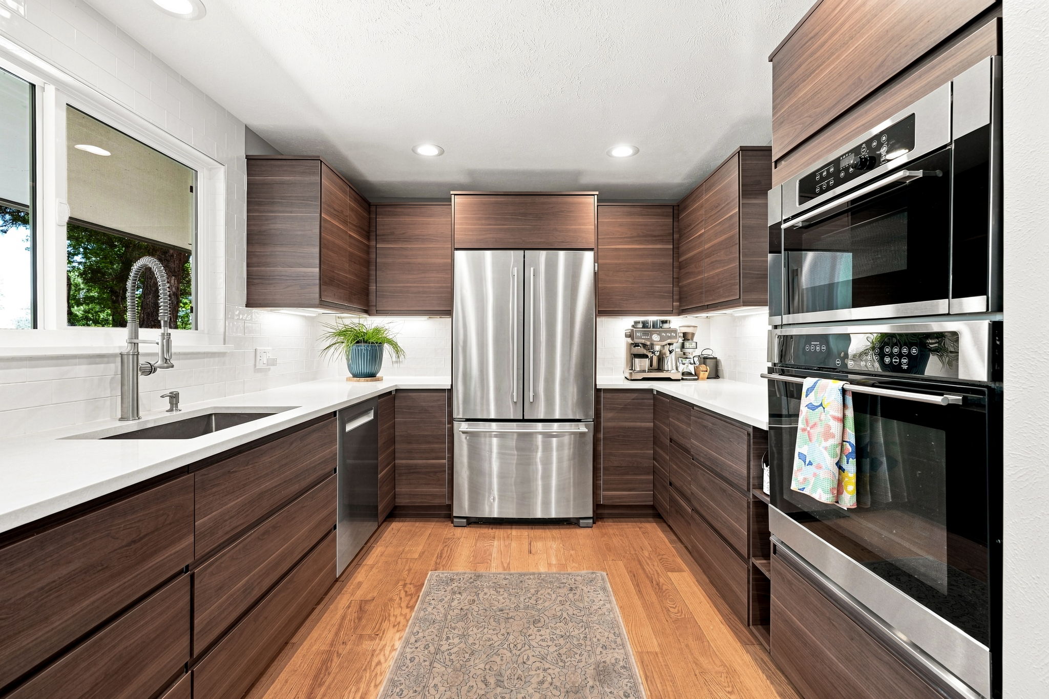 Modern cabinetry, stainless appliances and generous prep space.