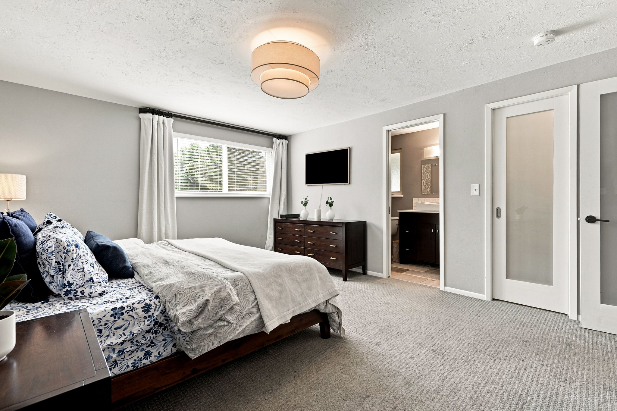 Primary bedroom with a private en suite bath.