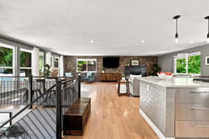 Exposed brick, steel accents and hardwood define the main living space.