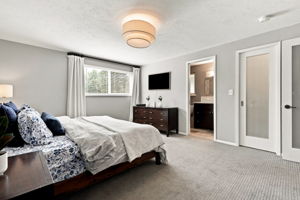 Primary bedroom with a private en suite bath.