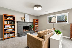 A second fireplace anchors the lower-level family room.