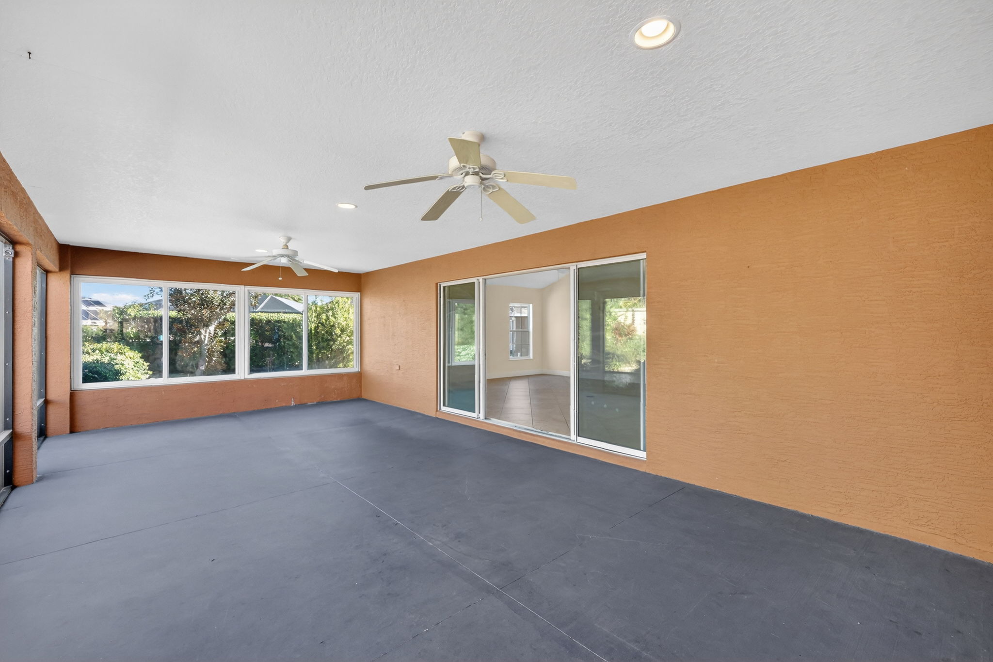 Expansive 30'x15' Lanai with Side Glass Windows and Rear Privacy Wall