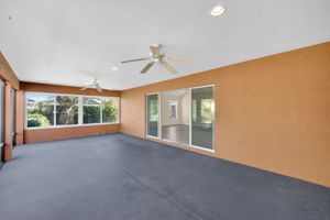 Expansive 30'x15' Lanai with Side Glass Windows and Rear Privacy Wall