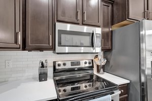 Stainless Steel Appliances & Tile Backsplash